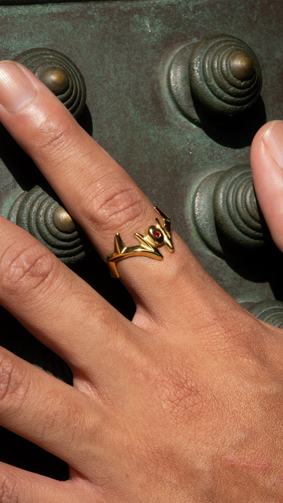 MALEVOLENT gold ring outdoors