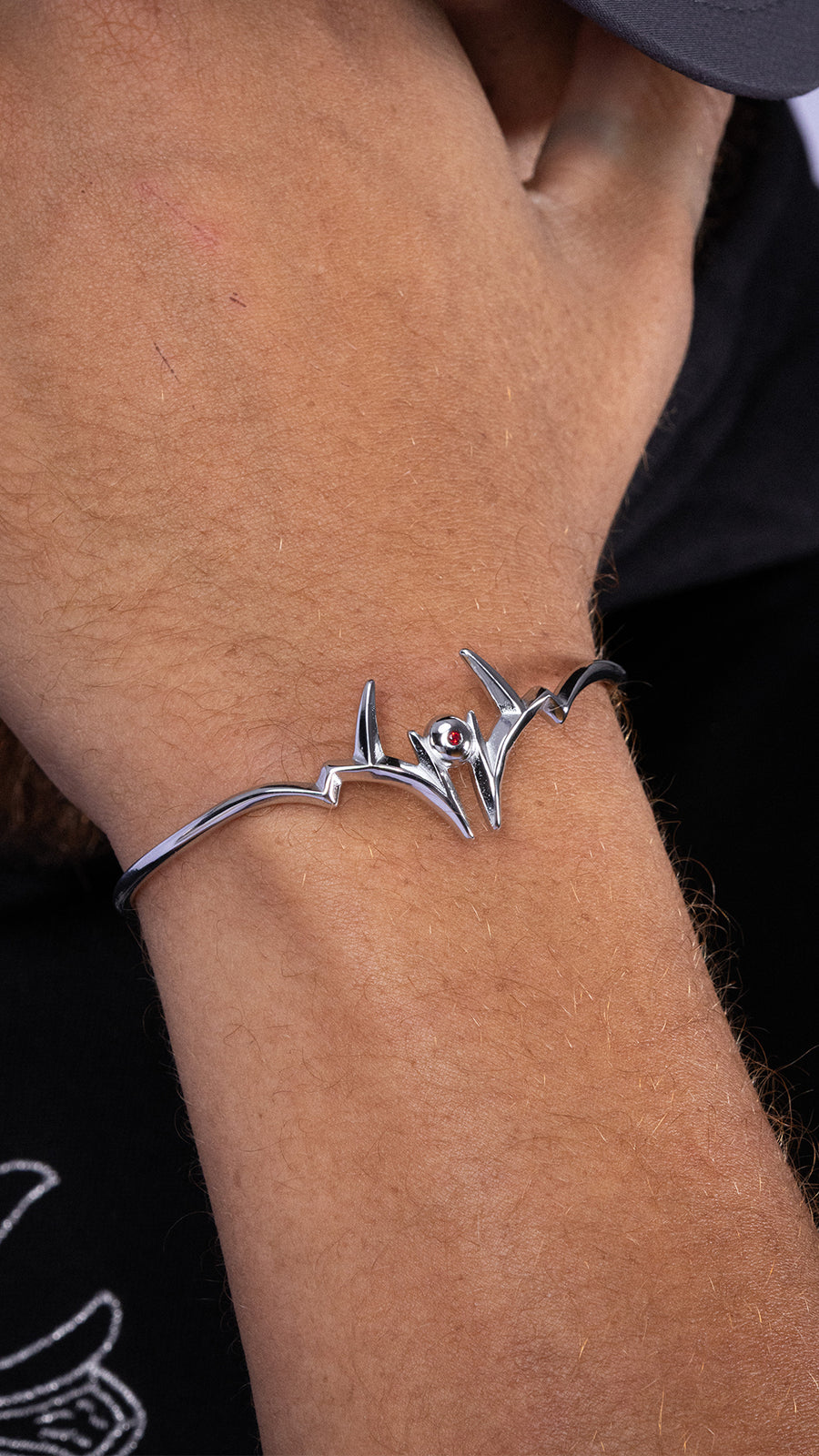 MALEVOLENT silver bracelet on wrist